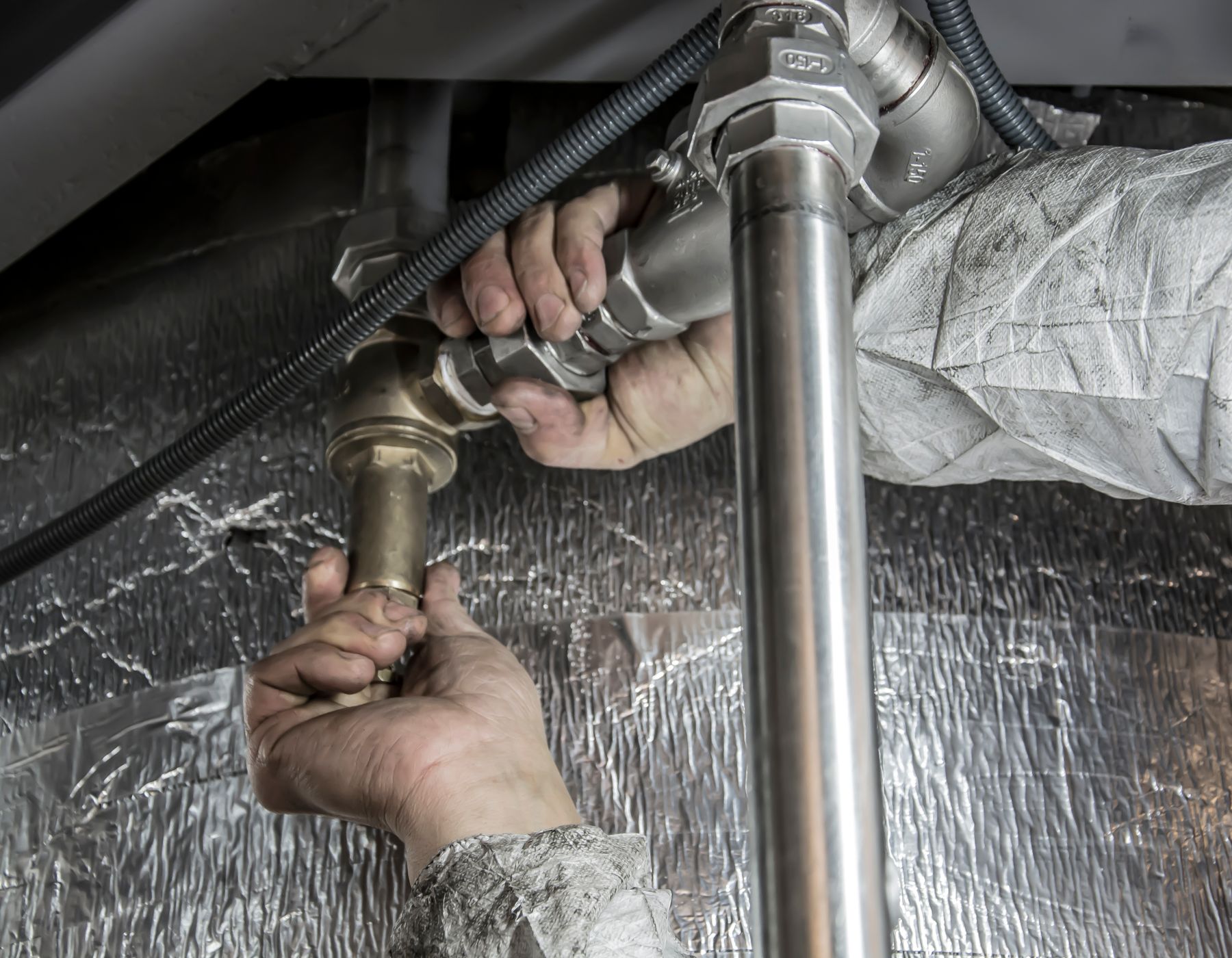 Plumber fitting pipework